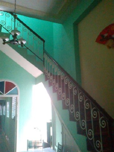 'Comedor y escaleras' Casas particulares are an alternative to hotels in Cuba.